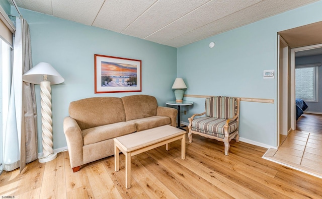 sitting room featuring hardwood / wood-style floors and a wealth of natural light