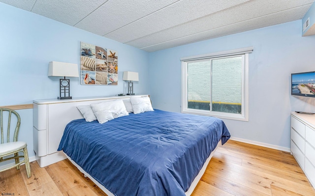 bedroom featuring light wood-type flooring