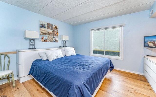 801 E 10th St Unit 255, Ocean City, NJ 08226 - bedroom with hardwood / wood-style flooring and baseboards