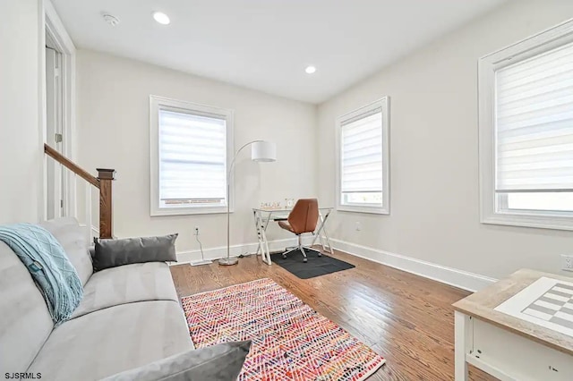 sitting room with wood-type flooring