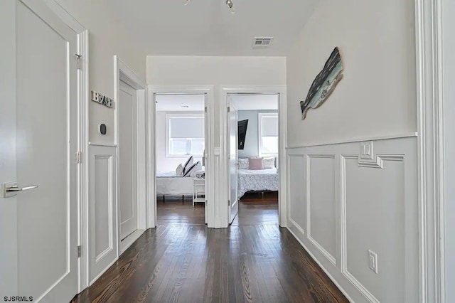 hallway featuring dark hardwood / wood-style floors