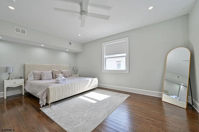 bedroom featuring ceiling fan and dark hardwood / wood-style floors