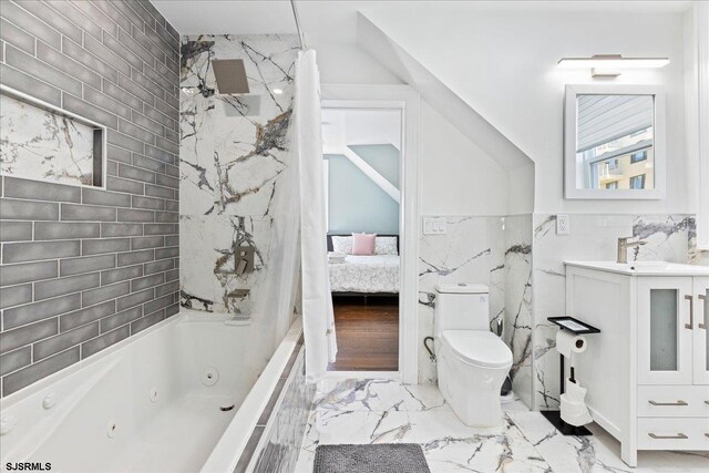 107 S Austin Ave, Ventnor, NJ 08406 - full bath with marble finish flooring, toilet, ensuite bath, tile walls, and vanity