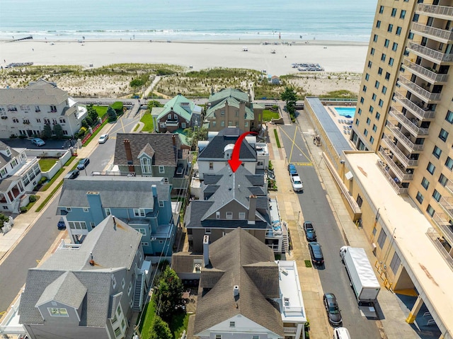 aerial view with a view of the beach and a water view