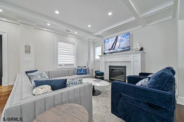 living room with wood-type flooring, crown molding, beam ceiling, and coffered ceiling