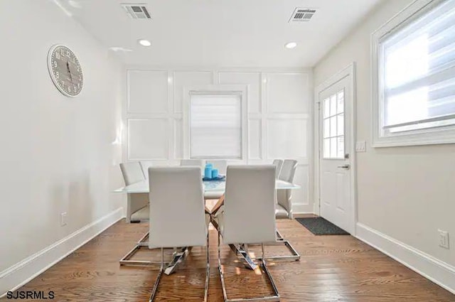 dining room with dark hardwood / wood-style flooring