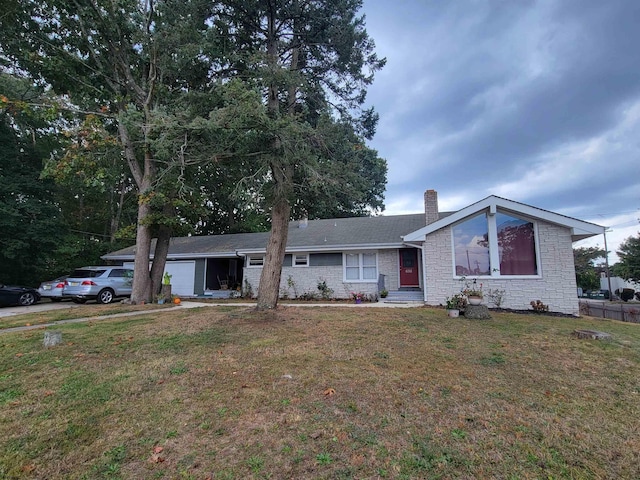 ranch-style house with a front yard