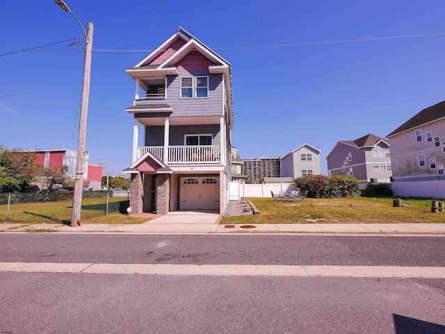 view of front of house featuring a front lawn, a balcony, and a garage