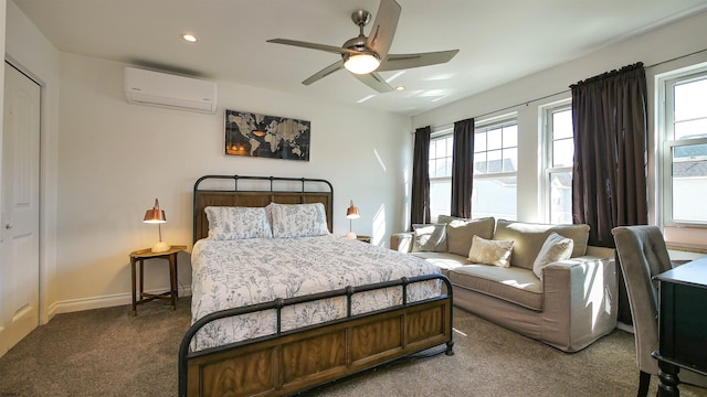 carpeted bedroom featuring ceiling fan, a closet, and an AC wall unit