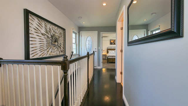 corridor with hardwood / wood-style floors