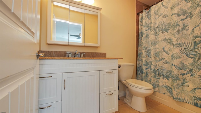 full bathroom with tile patterned flooring, shower / tub combo, vanity, and toilet