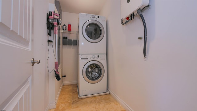 laundry room with stacked washer / drying machine