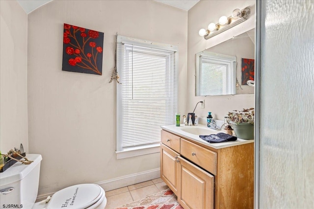 bathroom featuring tile patterned floors, vanity, and toilet