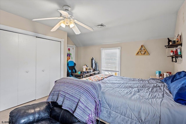 carpeted bedroom featuring lofted ceiling, a closet, and ceiling fan