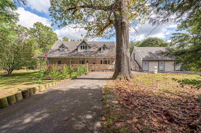 view of front of property with a porch and a garage