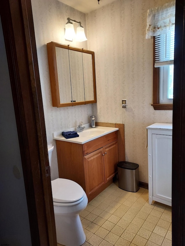 bathroom with vanity and toilet