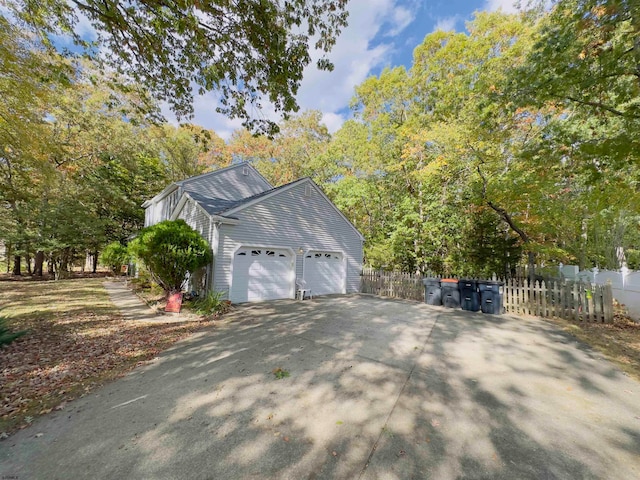 view of side of property featuring a garage