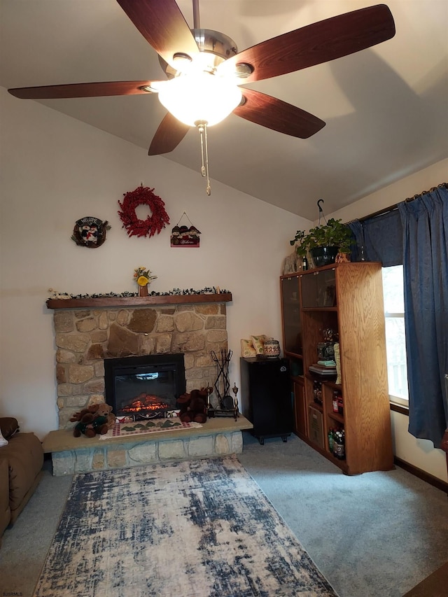 carpeted living room with ceiling fan, lofted ceiling, and a fireplace