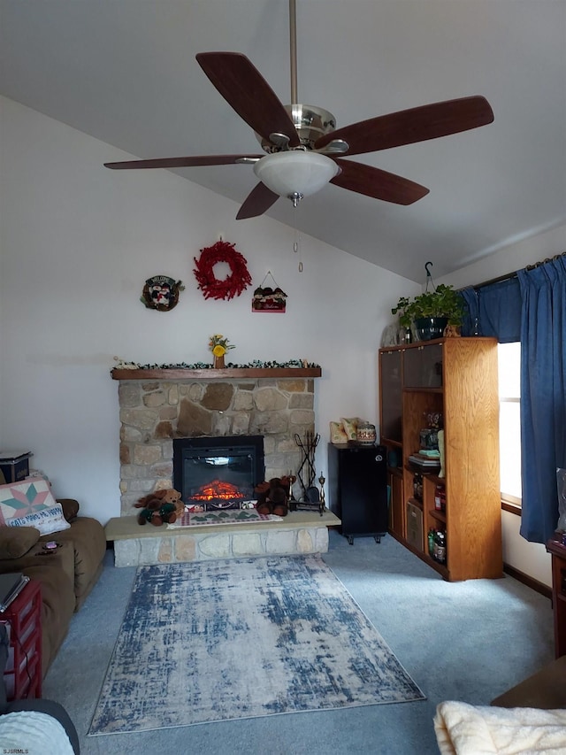 carpeted living room with lofted ceiling and a stone fireplace