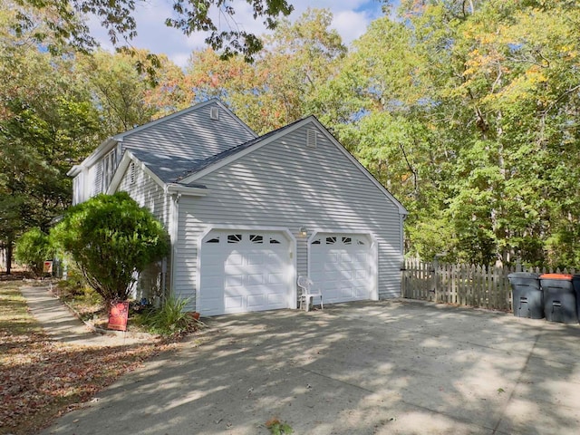 view of side of home with a garage