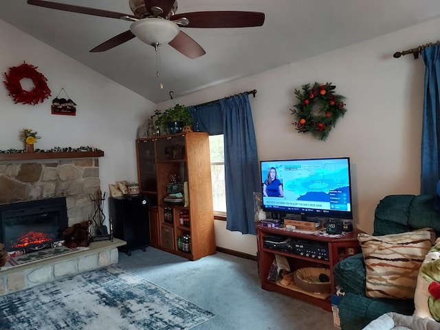 living room with vaulted ceiling, carpet, ceiling fan, and a fireplace