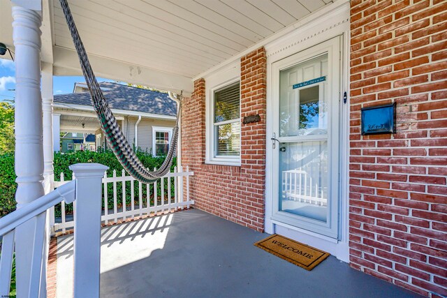 entrance to property with covered porch