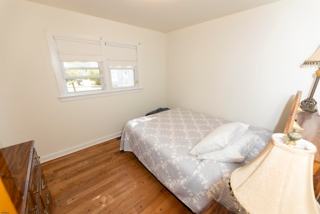 bedroom featuring dark hardwood / wood-style flooring