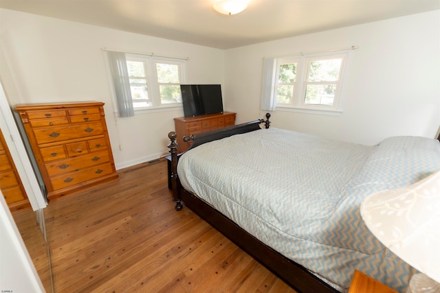 bedroom featuring dark hardwood / wood-style flooring