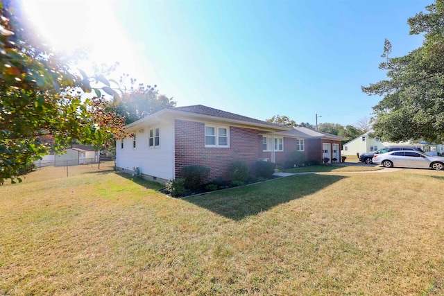 view of property exterior with a yard