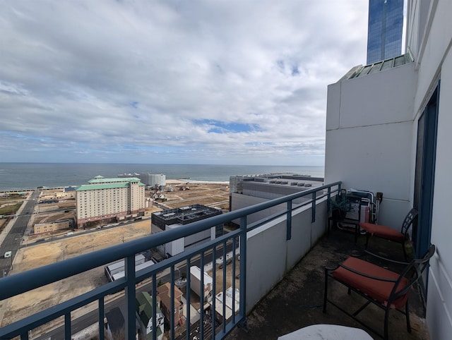 balcony featuring a water view