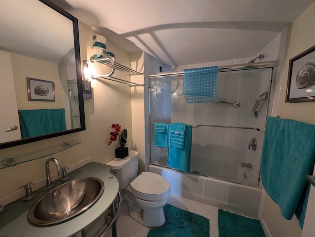 full bathroom with toilet, combined bath / shower with glass door, vanity, and tile patterned flooring