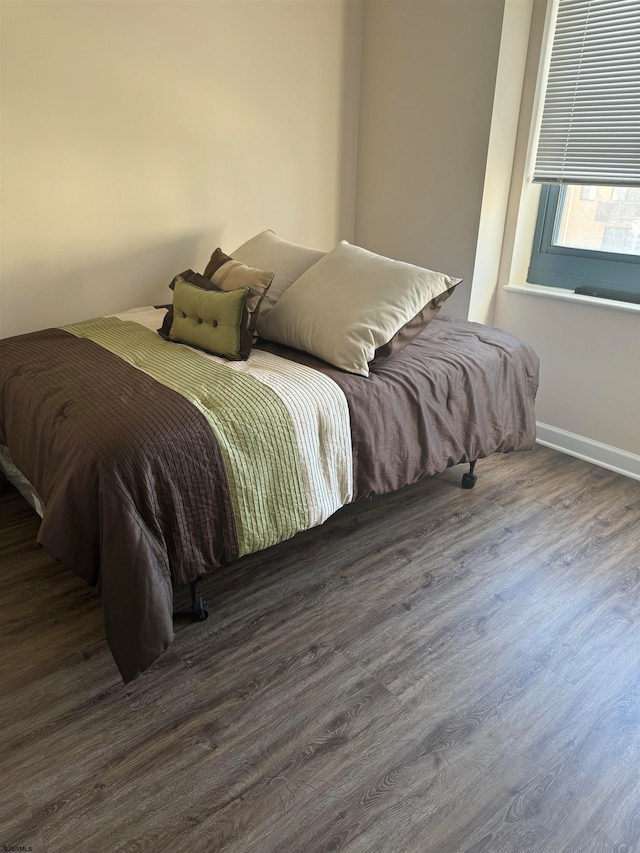 bedroom featuring dark hardwood / wood-style flooring