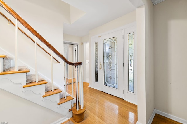 entryway with light hardwood / wood-style floors