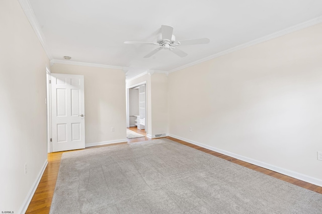 spare room with ornamental molding, hardwood / wood-style floors, and ceiling fan