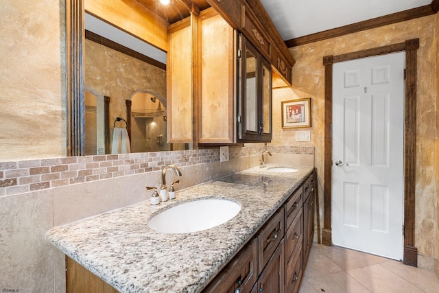 bathroom with vanity, ornamental molding, and tile patterned floors