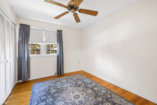 empty room featuring ceiling fan and light hardwood / wood-style flooring