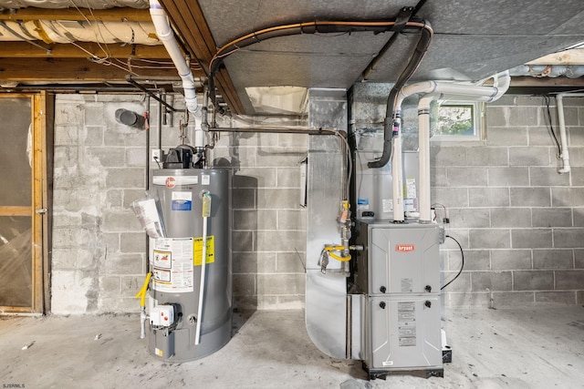 utility room featuring water heater and heating unit