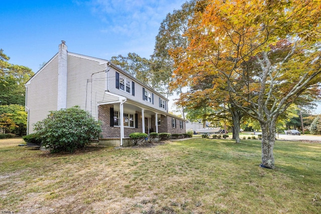 view of home's exterior featuring a lawn