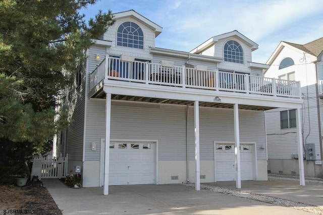 view of front of house with a deck and a garage