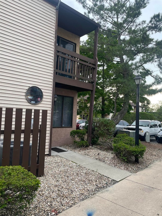 view of property exterior featuring a balcony