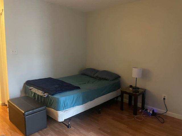 bedroom featuring hardwood / wood-style floors