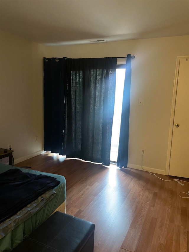 bedroom featuring hardwood / wood-style floors