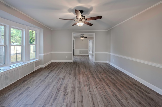 spare room with dark wood-type flooring and ornamental molding