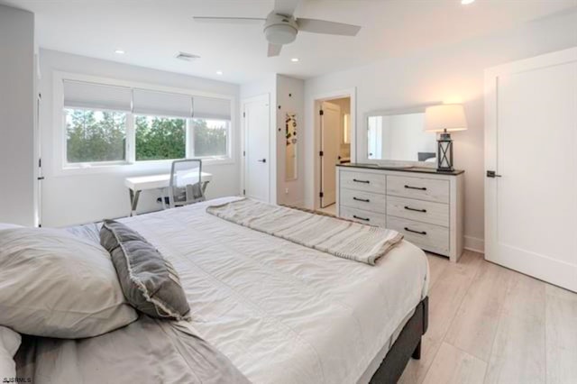 bedroom featuring ceiling fan and light hardwood / wood-style floors