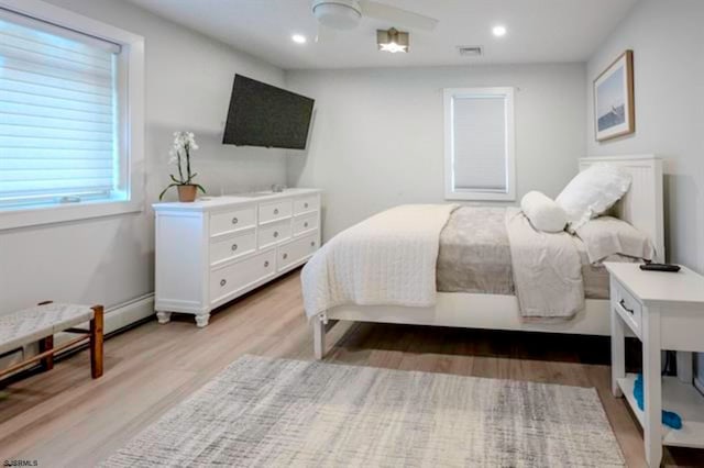 bedroom featuring light wood-type flooring and ceiling fan