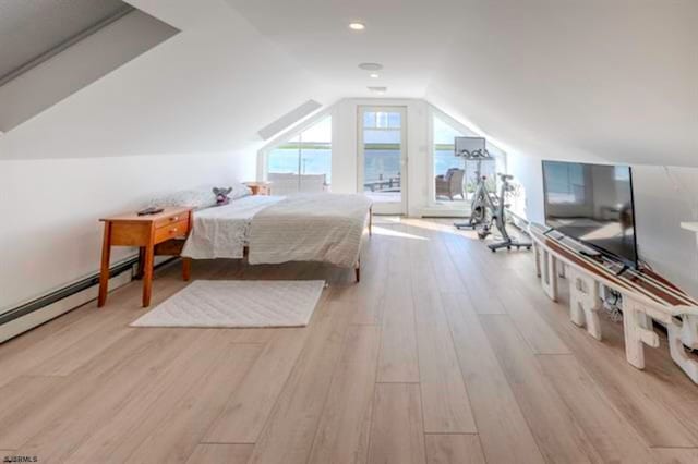 bedroom featuring lofted ceiling and light wood-type flooring