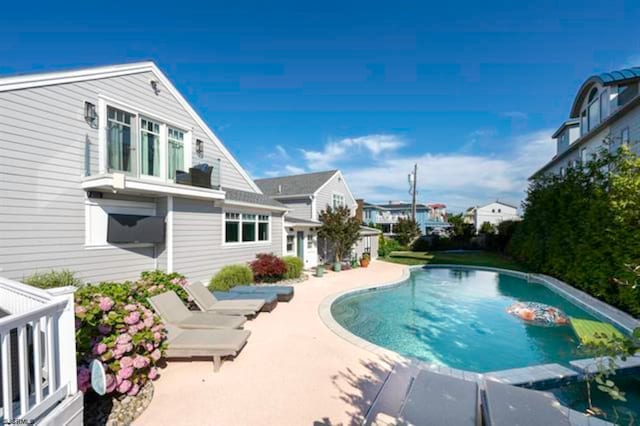 view of swimming pool with a patio