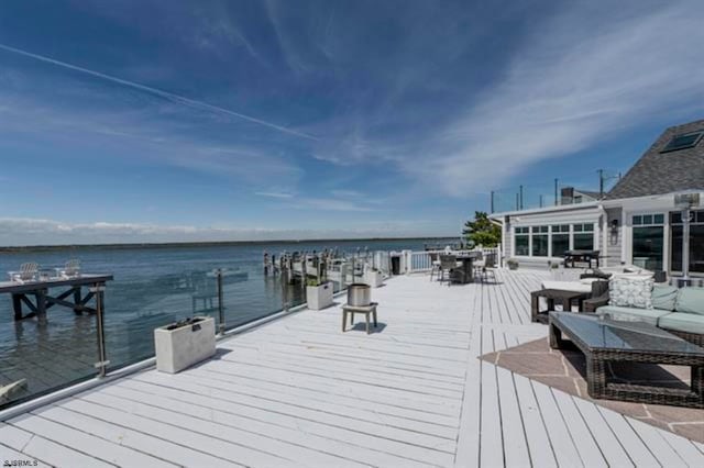 view of dock featuring a water view and an outdoor hangout area