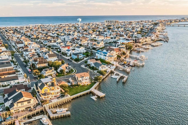 aerial view at dusk with a water view