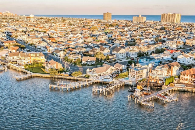 aerial view at dusk with a water view